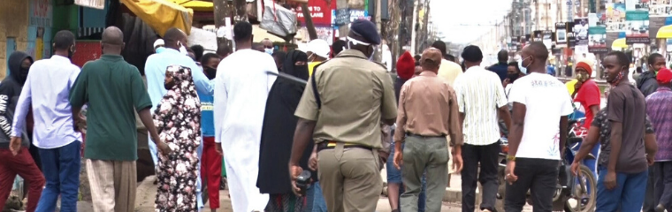 A police officer is seen enforcing the cessation of movement order in Eastleigh, Nairobi on May 7/CFM/MOSES MUOKI