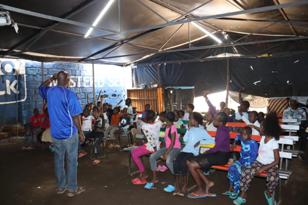 Ongoing learning session in a dilapidated hall