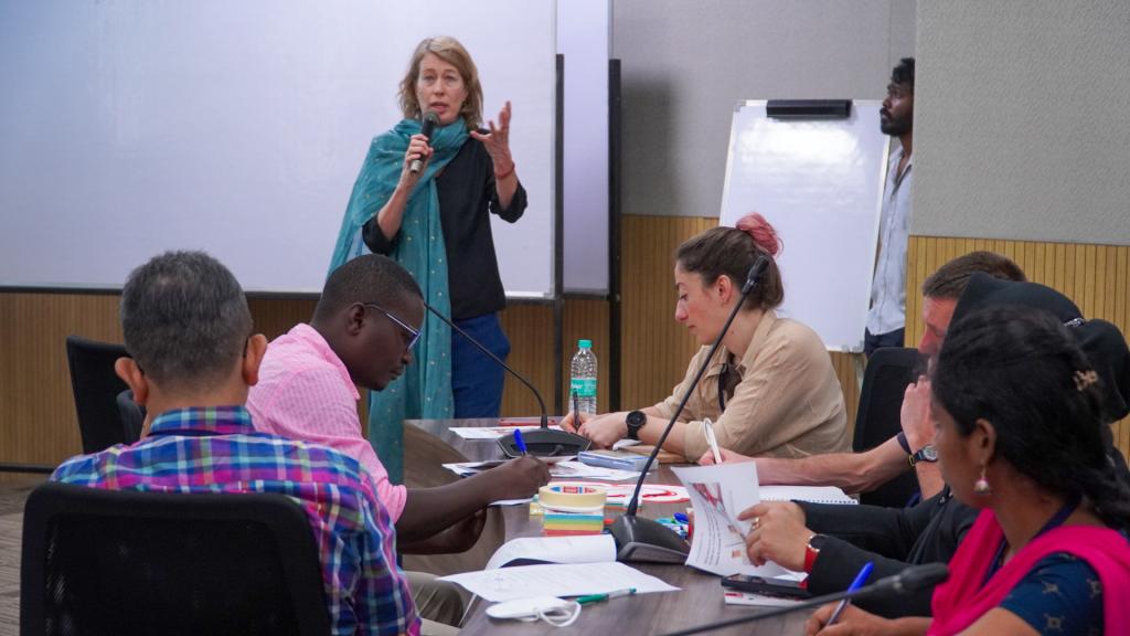 Dr Maartje van Eerd presenting in front of the group